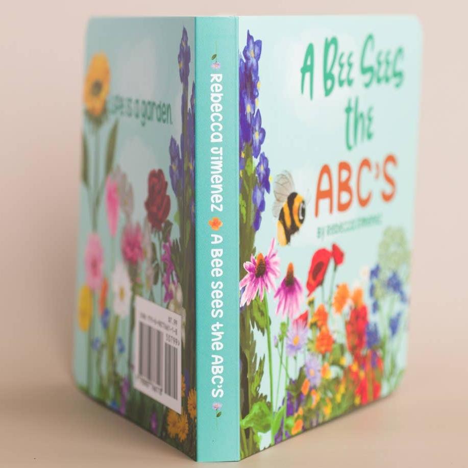 Honey - A Bee Sees The ABC's Baby Board Book spine view with title and upc code visible.