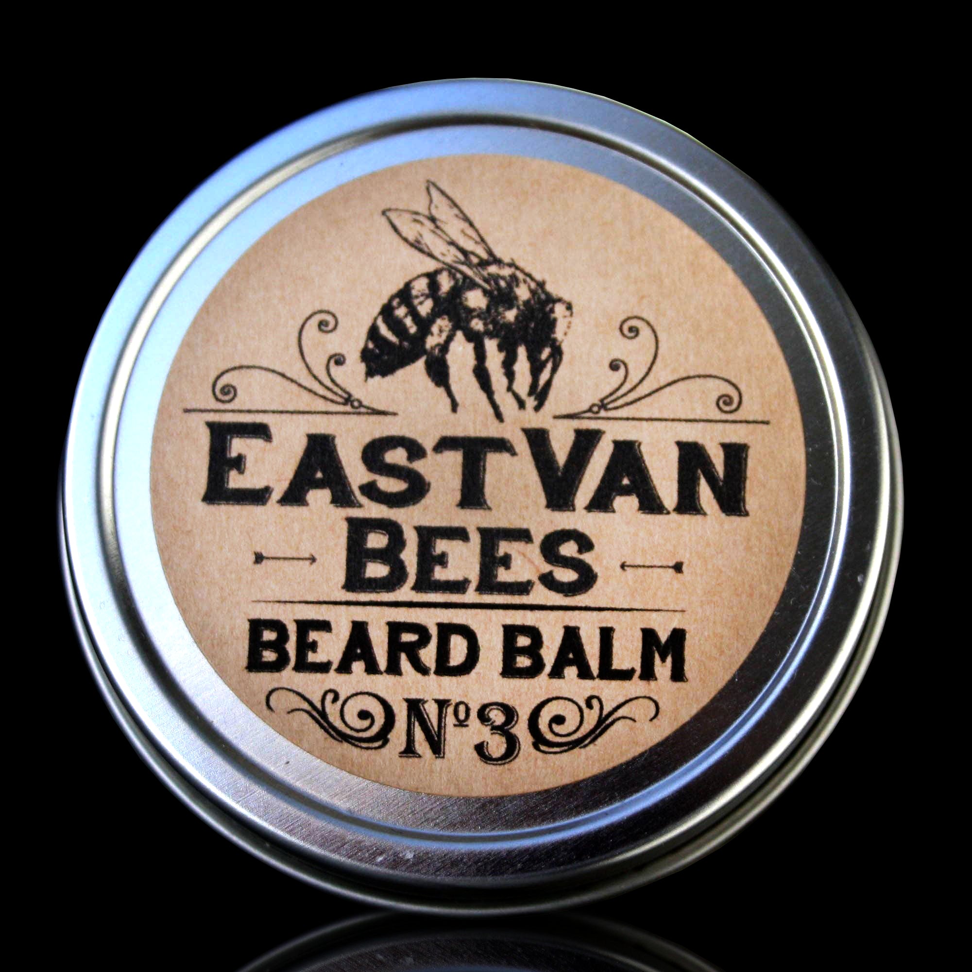 Accessories & Crocks - Beard Balm #3 by EastVan Bees ,for Higbee Honey in a 2 oz. tin on a black background.