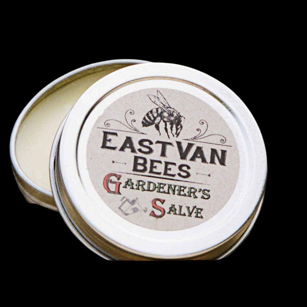 Accessories & Crocks - Higbee Honey East Van Bees Gardeners Salve in a small silver tin on a black background.