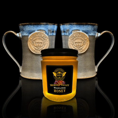 Gift Packages & Sets - Gift Set:  Two Limited Edition Handcrafted artisanal stoneware Mugs  in blue and gray with the Higbee Honey seal stamped in the side And 12 Oz Morgan Valley Wildflower Honey  with reflection on a black background.